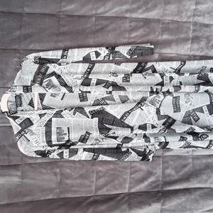 VERY CUTE newspaper cardigan. size large